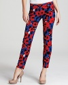 These DKNY printed pants take the color trend to stylish new levels in a vivid poppy print. This versatile pair can work at the office or work it at a house party.