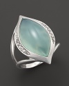 Faceted white sapphires surround a gleaming seafoam chalcedony cabochon, set in sterling silver. By Elizabeth Showers.