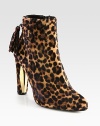 A fierce leopard print covers this silhouette of fine calf hair, with an unexpected gold-plate heel and back tassel. Calf hair and lacquer heel, 4 (100mm)Leopard-printed calf hair upperSide zipperLeather liningRubber solePadded insoleMade in Spain