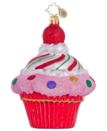 Simply irresistible, the cupcake ornament from Christopher Radko is decorated with glittery pink frosting, sprinkled with dots, topped with a cherry and entirely handcrafted in Polonaise glass.