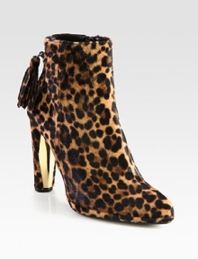 A fierce leopard print covers this silhouette of fine calf hair, with an unexpected gold-plate heel and back tassel. Calf hair and lacquer heel, 4 (100mm)Leopard-printed calf hair upperSide zipperLeather liningRubber solePadded insoleMade in Spain