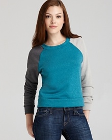 The color-block trend goes nonchalant in this ALTERNATIVE pullover, boasting a patchwork of hues.