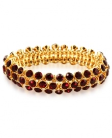 An elegant finishing touch from Anne Klein. Glass and plastic stones in red hues lend a look of romance to this bracelet. Crafted in gold tone mixed metal. Approximate diameter: 3 inches. Stretches to fit wrist.