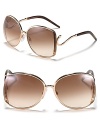 Feel like a movie star in large oversized round sunglasses with textured edges and hook shaped arms.