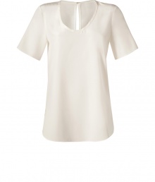 A pristine ecru hue and delicate washed silk inform this chic and versatile tee from Joseph - Scoop neckline, short sleeves, slit at nape with hidden hook closure, shirttail hemline - Loose fit - Wear with leather leggings and ankle boots, or tucked into a pencil skirt with heels