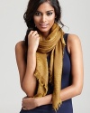 An elegant Tory Burch woven scarf with subtle logo print all over.