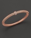 A row of diamonds binds this woven 18K rose gold bracelet from Roberto Coin.