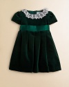 A delicate lace collar adorns the neckline of this plush velvet frock with matching satin sash for a party-perfect look.Lace collarShort puff sleevesBack zipperWaistband with satin sashPleated skirtCottonMachine washImported