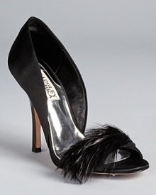 A furry feather lends feminine style to the Badgley Mischka Gisella pumps, featuring low cut d'Orsay sides for added allure.