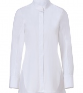 Perfect for layering over slim-cut separates, Jil Sanders stand-up collar blouse is essential for modern-minimalist looks - Stand-up collar, long sleeves, wide buttoned cuffs, hidden button-down front, slit sides, curved hemline - Longer length, tailored fit - Wear with bright skinnies, flats and sleek leather totes