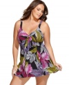 A lush tropical print makes a bold statement! This Swim Solutions plus size swimdress gives you a sultry look with the tummy control and coverage you want.