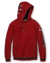 Edgy, vintage-inspired graphics toughen up this practical pullover hoodie by GUESS Kids.