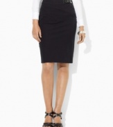 A heritage-inspired faux-leather buckle at the waist updates Lauren by Ralph Lauren's classic pencil skirt silhouette, crafted in sleek stretch twill.