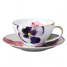 Pensees teacup by Bernardaud. This lively, luxurious teacup is sure to transform your table into a celebration of spring. The floral watercolor pattern features delicate, multicolored pansies that appear to be strewn across the surface of each piece.