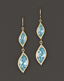 Pavé diamonds frame faceted blue topaz, set in 18K gold leaves. By Carelle.