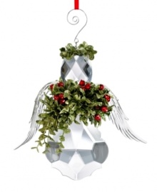 Peace and love. An angel with glistening wings clutches a bouquet of holiday greens in this distinctive kissing ball from Trans Pac.