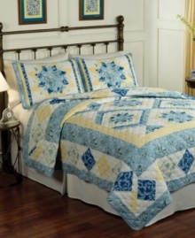 This Temperance Lane quilt features graceful blossoms and a beautifully quilted diamond design for a delicate appeal. A blue, white and pale yellow palette gives the set a soothing quality.