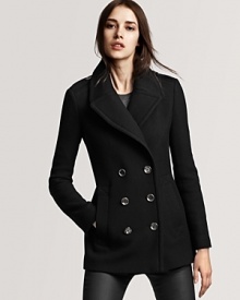 Classic tailoring and wide lapels make this chic peacoat elegant and refined.