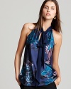 With an abstract floral printed front and a sleek, solid back, T Tahari's Dylan blouse is a study in chic contrasts.