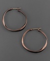 Natural style by Fossil. This hoop earrings are crafted in ion-plated brown mixed metal. Approximate drop: 1-1/4 inches.