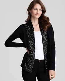 Glam up chilly-weather looks in this C by Bloomingdale's sequin cardigan. A glimmering shawl highlights day or nighttime style.