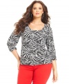 Capture safari style with MICHAEL Michael Kors' three-quarter-sleeve plus size top, featuring a zebra-print.