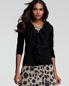 Flirtatious ruffles cascade down the front of this cardigan from C by Bloomingdale's for everyday, feminine style.