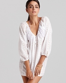 Joie a la Plage's eyelet-trimmed tunic is a cute way to take cover. This romantic style slips over your favorite bikini with flat sandals to take you from pool-side to pretty.