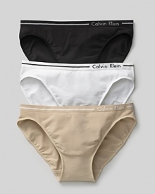 Calvin Klein Underwear seamless bikini. A comfortable seamless bikini with logo and stripe detail on waistband. Cotton gusset.