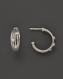 Brilliant diamonds accent bands of sterling silver in India Hicks' hoop earrings.