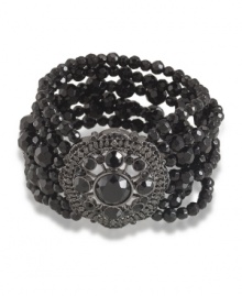 Crafted in hematite tone mixed metal with a striking seven-row design, Carolee's stretch bracelet is elaborately embellished with jet crystals. Bracelet stretches to fit wrist. Approximate diameter: 2-1/4 inches.