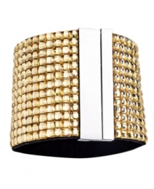 Gold rush. Gorgeous golden-hued Colorado glass accents adorn this chic cuff bracelet from Catherine Stein. Made in silver tone mixed metal, it adds instant drama to any look. Includes a magnetic closure. Approximate length: 7-3/8 inches.