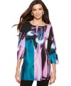 A floral print in bright watercolors makes for a perfect feminine tunic to wear this Spring. From Alfani.