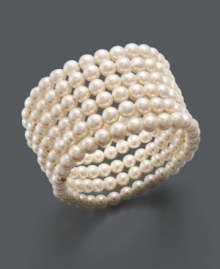 Traditional pearls with a modern twist. Charter Club cuff bracelet features six polished rows of cream-colored plastic pearls in a mixed metal setting. Bracelet stretches to fit wrist. Approximate diameter: 2-1/4 inches.