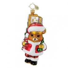 A bear takes on Santa's duties, toting toys and cheer to children in this Pediatric Cancer Awareness holiday ornament.