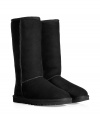 A tried-and-true cold weather staple, these tall classic shearling boots from UGG Australia boast comfort and utilitarian chic - Round toe, rugged rubber sole, exposed seams, cozy shearling lining, back logo detail - Tall shaft height - Pair with skinny jeans, an oversized cashmere sweater, and a down jacket or wool cape