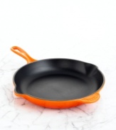 A classic kitchen workhorse, Le Creuset's heavyweight skillet is a culinary tradition crafted to sear and fry with professional precision. The expertly enameled cast iron exterior ensures uniform heating and even cooking, while the satin black enamel interior seals in juices and flavors. Limited lifetime warranty.