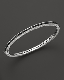 Black sapphires stud a sterling silver bangle from Judith Ripka.