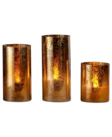 With a beautiful crackled glass construction and warm gold hue, this trio of LED pillars makes your home more inviting this holiday season with a festive glow.