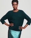 In a chunky knit, Tibi's ultra-soft sweater makes an unexpected exit with a subtle, open back.