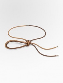 Two colors of leather cord designed to tie artfully around the waist, attached and tipped with subtle metal accents.Diameter, ¼LeatherMade in Italy of imported fabric