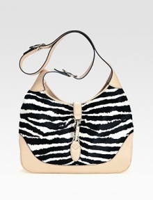 Lush zebra-striped haircalf pairs with rich leather in a roomy carryall.Adjustable and detachable shoulder strap, 8¾-19¾ dropPiston clasp closureOne inside zip pocketOne cell phone pocketOne PDA pocketLinen lining13W X 8¾H X 2¾DMade in Italy of imported fabric