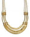 Be a trendsetter in this chic statement necklace from Style&co. The three-row design highlights golden beads, tubular accents and linked bars. Crafted in gold tone mixed metal. Approximate length: 18 inches.