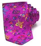 A detailed butterfly and floral print in vibrant colors adorns this silk tie from DUCHAMP.