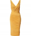 The ultimate figure-hugging dress, this draped Donna Karan favorite will have you turning heads while maintaining comfort - V-neckline with faux wrap detail, sleeveless, front and back twist drape detail, fitted pencil silhouette - Style with statement sandals, a draped front leather jacket, and a studded clutch