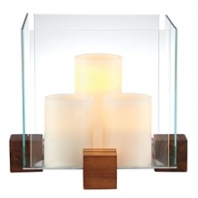 Create an artful showcase of candlelight and favorite objects displayed inside this striking piece from Dansk. In an elegant pairing of raw materials and minimalist design, blocks of richly grained wood support thick panes of sparkling clear glass.