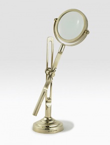 This fully functioning standing magnifier is crafted in a vintage-inspired silhouette from antiqued brass. 11½H X 4 diam.Brass and glassImported