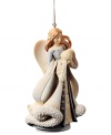 A guardian angel to watch over your and your family, this Angel with Globe ornament sits upon your tree throughout the season, boasting a gentle look with crystal embellishments.