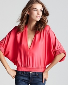 Elevate your every day with a stretch silk DIANE von FURSTENBERG top, featuring graceful dolman sleeves and on a cropped, loose fitting silhouette.