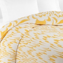 A pop art-inspired play of sunny yellow and bright white wing shapes on this DIANE von FURSTENBERG king duvet refreshes your bedroom decor with versatile contemporary style.